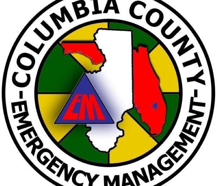 Circular emblem with Emergency Management Columbia County written on it