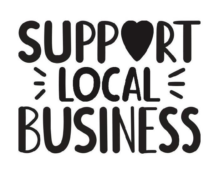 Sign with Support Local Business on it